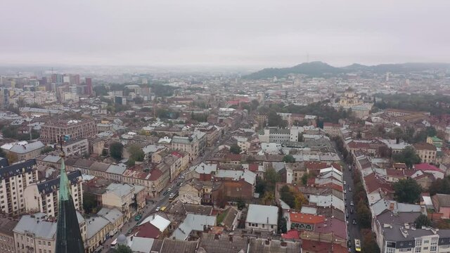 Aerial drone video of city Lviv, Ukraine. Flight above roofs and streets. Panorama of ancient popular central part of old European town Lvov, Ukraine. 4K footage. Church of Saints Olga and Elizabeth