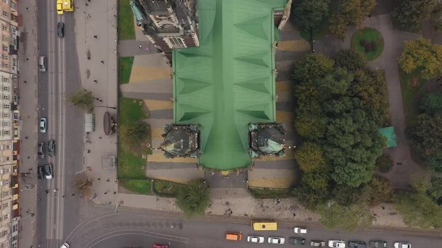 Aerial view of historical center of Church of St. Olga and Elizabeth old gothic temple in town Lviv, Ukraine. Flying by drone over dome. 4K UHD footage of landmarks, architecture of european Lvov city