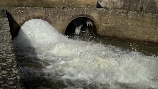 Dam discharge pipes, drainage with rapis water flowing during the flood period
