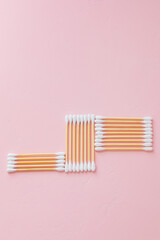 environmentally friendly bamboo and cotton cotton buds on a pink background, bamboo toothbrushes for adults and children. human personal hygiene products without harming the environment, biodegradable