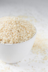 Raw rice in a white  bowl