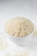 Raw rice in a white  bowl