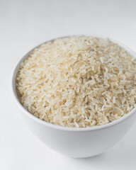 Raw rice in a white  bowl