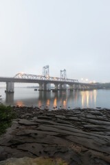 Fototapeta na wymiar Foggy morning view of Ryde Bridge, Sydney, Australia.