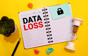 white piece of paper with text Data Loss Prevention on the background of the graphs, multi-colored felt-tip pens