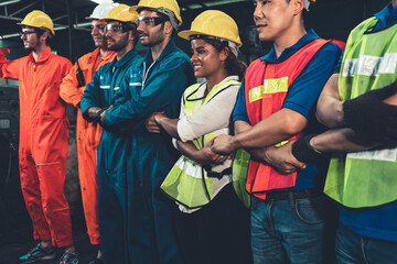 Skillful worker stand together showing teamwork in the factory . Industrial people and...
