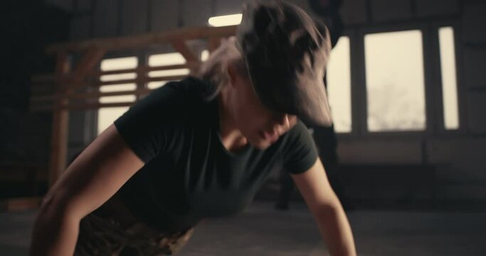 Military woman doing push ups