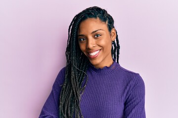 African american woman wearing casual winter sweater happy face smiling with crossed arms looking...