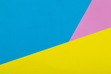 Colorful yellow, blue and pink pastel paper texture background, Geometric flat lay background.