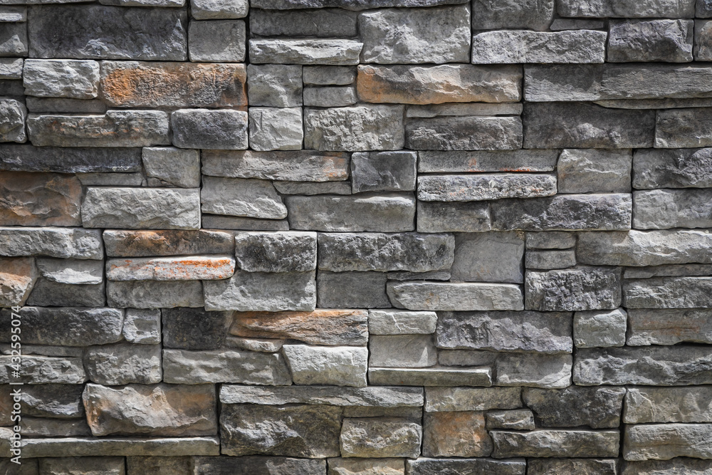 Poster background of gray stone wall made with blocks . pattern of slate wall texture and background