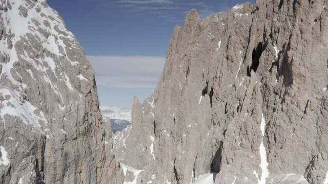 Aerial flight adove stunning Alps Cliffs. 
High mountain peaks sharp cliffs Dolomites, Italy
Drone view  from Italy Top Peaks 

