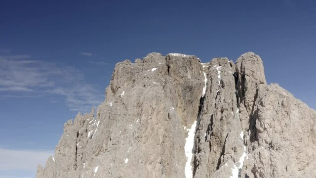 Aerial flight adove stunning Alps Cliffs. 
High mountain peaks sharp cliffs Dolomites, Italy
Drone view  from Italy Top Peaks 

