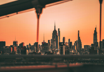 Fototapeta na wymiar city skyline at sunset panorama Empire State buildings new York sky orange 