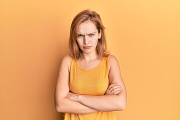 Young caucasian woman wearing casual style with sleeveless shirt skeptic and nervous, disapproving...
