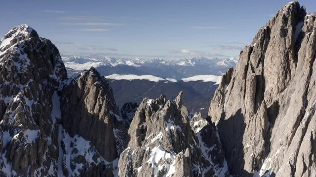 Aerial flight adove stunning Alps Cliffs. 
High mountain peaks sharp cliffs Dolomites, Italy
Drone view  from Italy Top Peaks 

