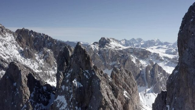 Aerial flight adove stunning Alps Cliffs. 
High mountain peaks sharp cliffs Dolomites, Italy
Drone view  from Italy Top Peaks 

