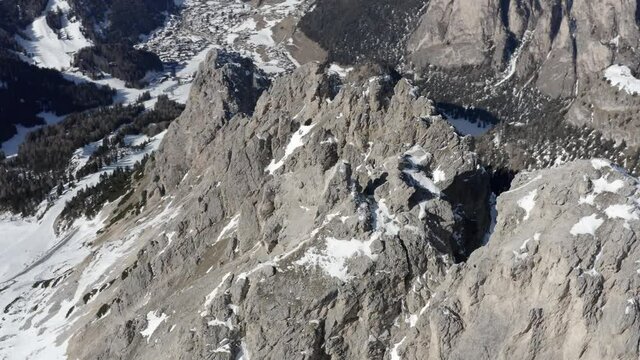 Aerial flight adove stunning Alps Cliffs. 
High mountain peaks sharp cliffs Dolomites, Italy
Drone view  from Italy Top Peaks 

