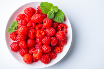 Fresh raspberries in a plate.