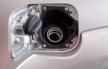 Closeup petrol tank of bronze pickup truck. Open the fuel tank door to fill the diesel fuel.