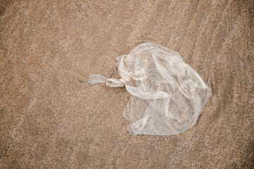 Environment, Ecology Care, Renewable Concept. Plastic Waste on the Beach Sand. Top View