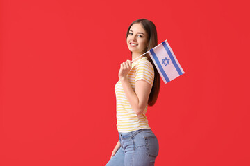 Young woman with the flag of Israel on color background