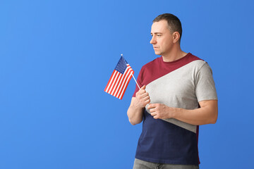 Man with USA flag on color background. Memorial Day celebration