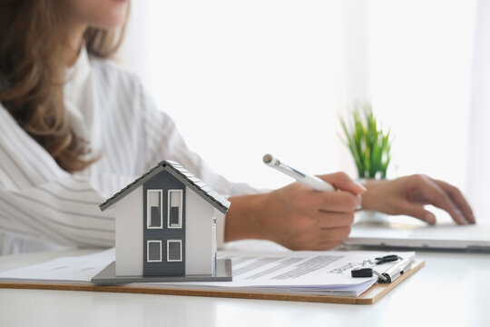 House model and key on table for finance and banking concept.Home purchase mortgage concept.