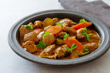 Beef tatarian goulash (azu)  in rustic old plate close up