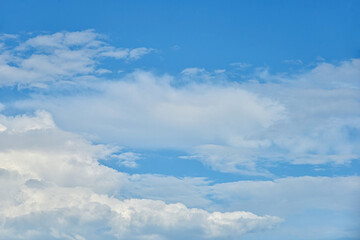 Fototapeta premium Beautiful white clouds on blue sky background.