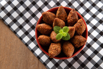 Kibbeh - Minced meat from the Middle East. Fried snack a typical Brazilian popular party dish (kibe). Top view