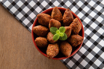 Kibbeh - Minced meat from the Middle East. Fried snack a typical Brazilian popular party dish (kibe). Top view