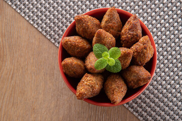 Kibbeh - Minced meat from the Middle East. Fried snack a typical Brazilian popular party dish (kibe). Top view