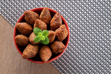 Kibbeh - Minced meat from the Middle East. Fried snack a typical Brazilian popular party dish (kibe). Top view