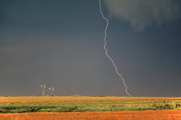 Rural landscape with an approaching thunderstorm and lightning - South Africa.