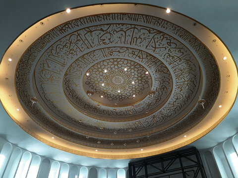 Arabic calligraphy sentences above the building ceiling at the Jami 'Soeprapto Soeparno Mosque, in Pangkalan Baru, Central Bangka Regency, Bangka Belitung Islands.