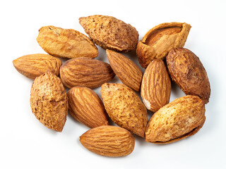 almond drupes and almond seeds closeup on white