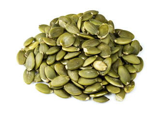 pile of peeled pumpkin seeds closeup on white