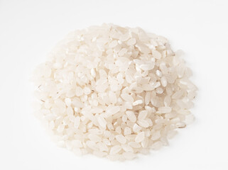 pile of raw medium-grain polished rice on white