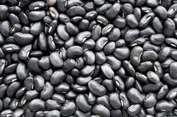 Fototapeta na wymiar Dry organic black bean seeds background, for healthy food ingredient or agricultural product concept
