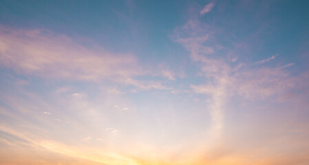 abstract color of pinky sky and white fluffy cumulus clouds with beautiful rays sunbeam shining in...