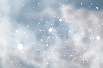 blue snowfall bokeh background, abstract snowflake background on blurred abstract blue