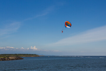 Parasailing over Pacific ocean
