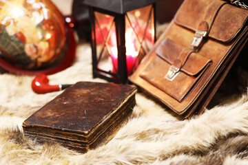 Retro old book and world desk globe on fur, learning and education concepts.