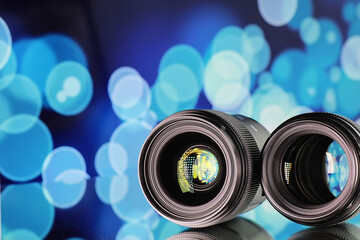 Equipment videographer and photographer. Lenses on the table against the background of bright...