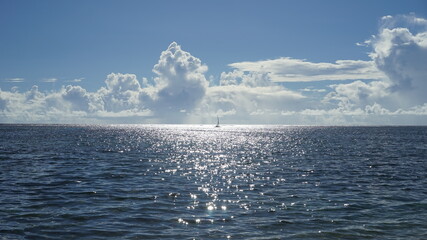 A yacht sailing in the middle of the sea