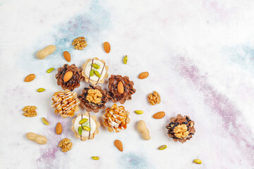 Various homemade mini tartlets with nuts and chocolate cream.