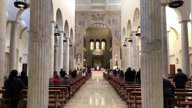 inside of the cathedral of benevento during a religious ceremony