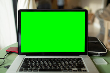 Chroma key screen of computer on table