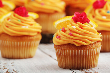 Cupcakes with orange icing on top