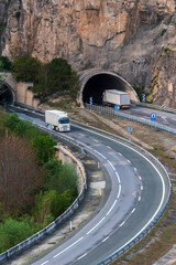 Trucks circulating at the entrance and exit of some tunnels in both directions.